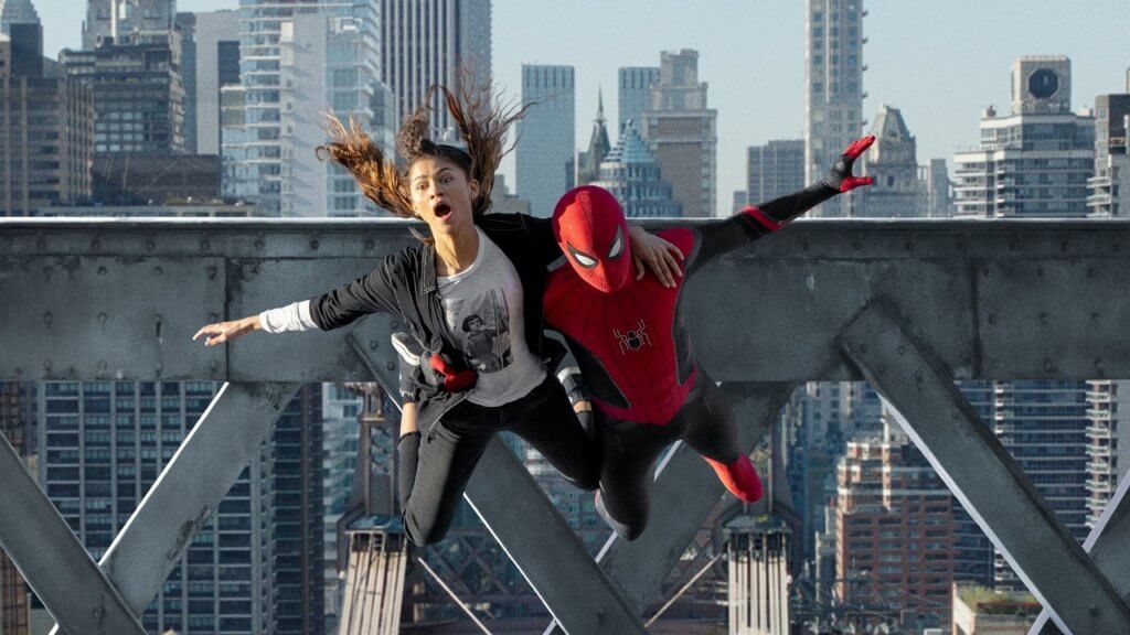 MJ e Homem-Aranha caindo em meio aos prédios. Ela com cara de pavor